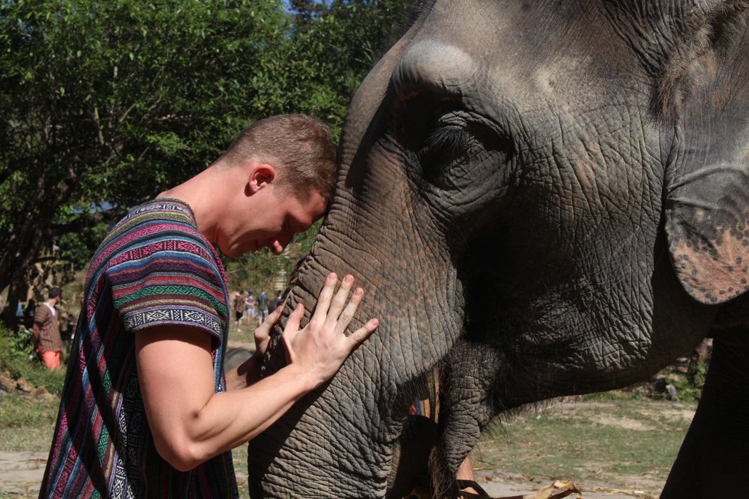 Jesse Henry with an elephant in Thailand